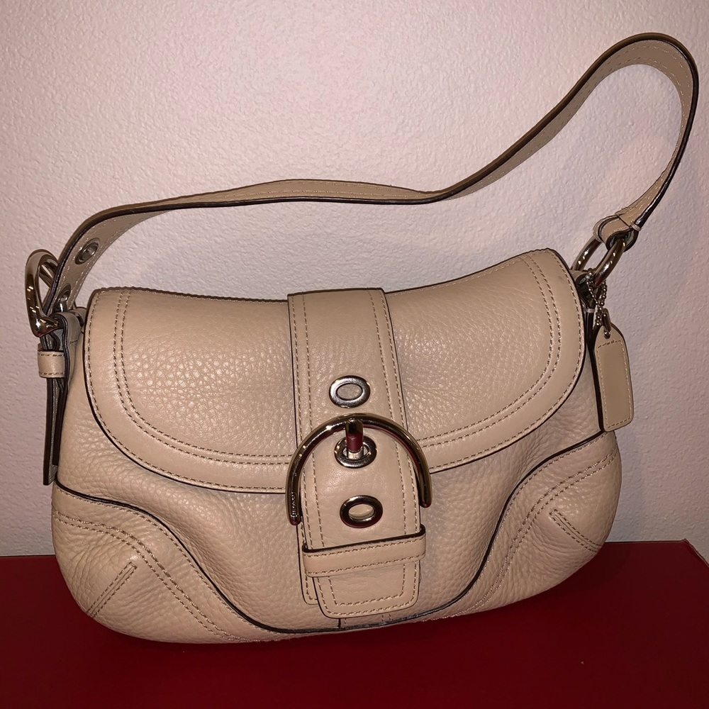 almond color coach leather shoulder bag.